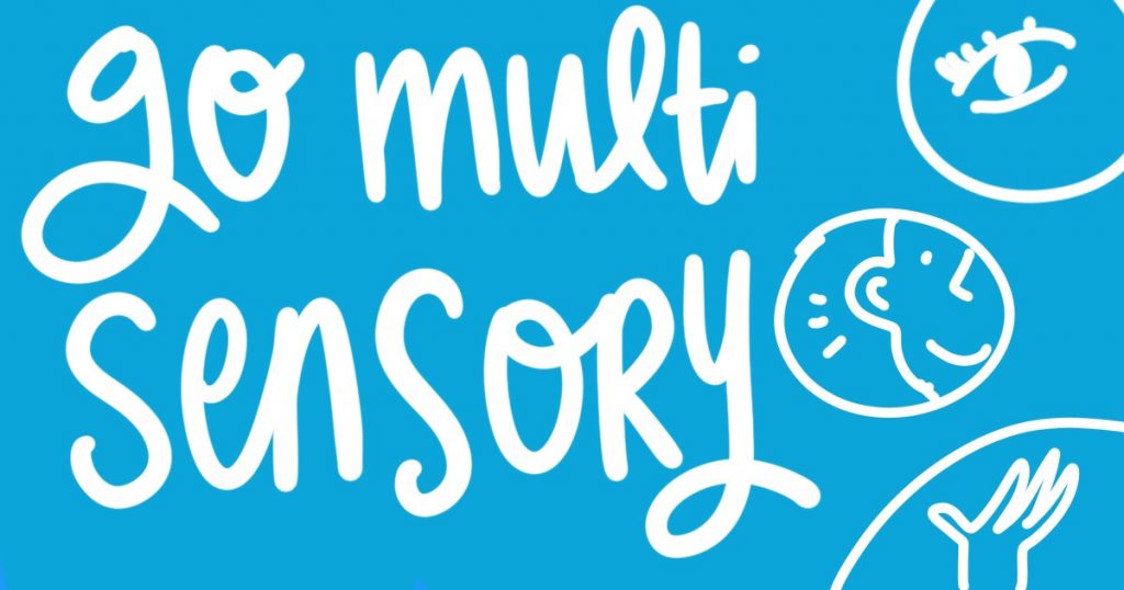 handwritten text on a vibrant coloured background: go multi sensory