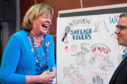 graphic recording with Shelagh Rogers by Sam Bradd, photo of them laughing together 
